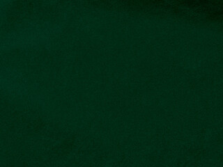 Dark green old velvet fabric texture used as background. Empty green fabric background of soft and smooth textile material. There is space for text.