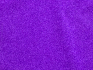 Purple velvet fabric texture used as background. Empty purple fabric background of soft and smooth textile material. There is space for text.