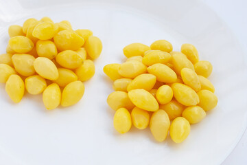 Boiled ginkgo nuts on white background.