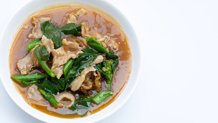 Fried flat noodle with pork and kale in gravy sauce
