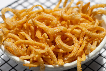 Crispy pork rinds or pork snack.