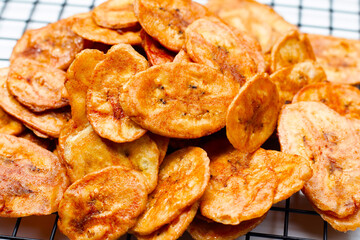 Banana chips on white background