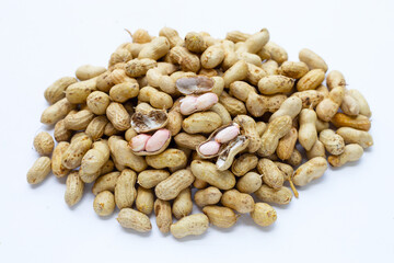 Raw peanuts on white background.