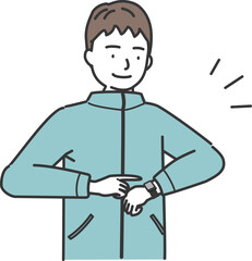 スマートウォッチをチェックするトレーニングウェアの男性