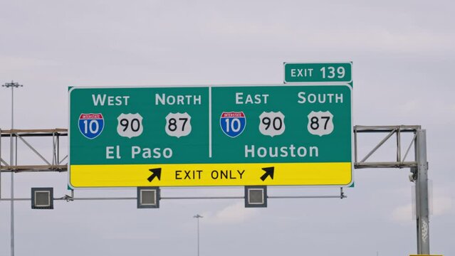 Direction signs to Houston and San Jose on the highway - travel photography