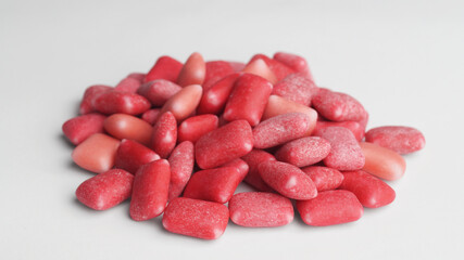 Pile of sweet chewing gums on white background