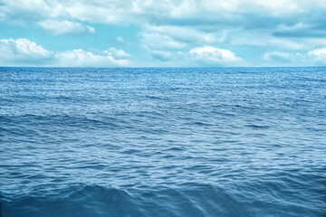 Beautiful view of seascape and blue sky with white clouds on sunny day