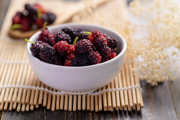 Fresh mulberry fruit in bowl, Healthy organic tropical fruit