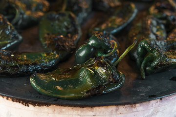 Close up of poblano peppers in a comal. Food.
