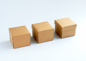 Three cardboard boxes isolated on white background. Carton gift box. Square kraft paper box with lid on top. Delivery, parcel, packaging with online shopping and shipping concepts.