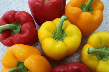red, yellow and orange bell peppers