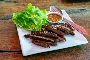 Fried dried beef on a white plate