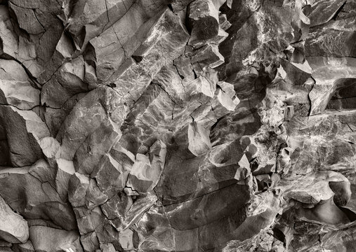 Intricate sculptural stone texture banner. Horizontal rock wall wallpaper.
