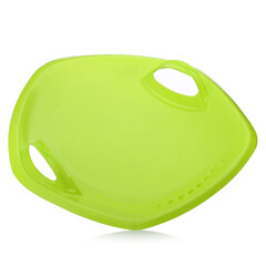Children's plastic green sled isolated on a white background. Sleds for skiing downhill in winter....
