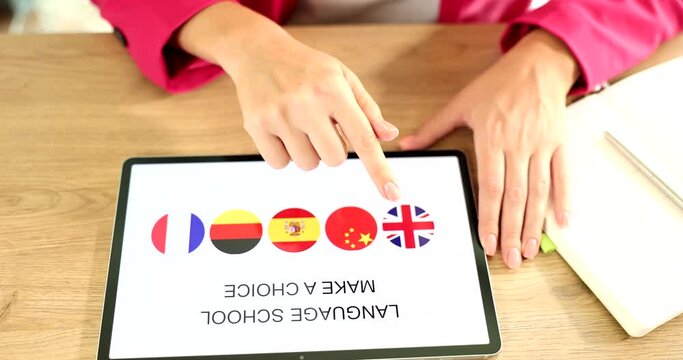 Tablet screen with app learning different languages in language school remotely