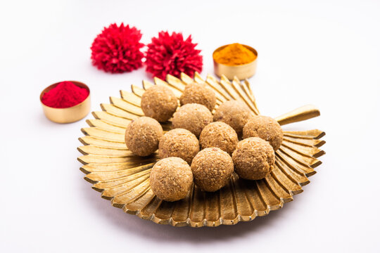 tilgul or til gul laddu or&nbsp;Sesame seed jaggery ball or til ke laddo with flower and haldu kumkum
