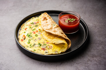 Omelette chapati roll or Franky. Indian Popular, quick healthy recipe for kid's tiffin or lunch box - obrazy, fototapety, plakaty