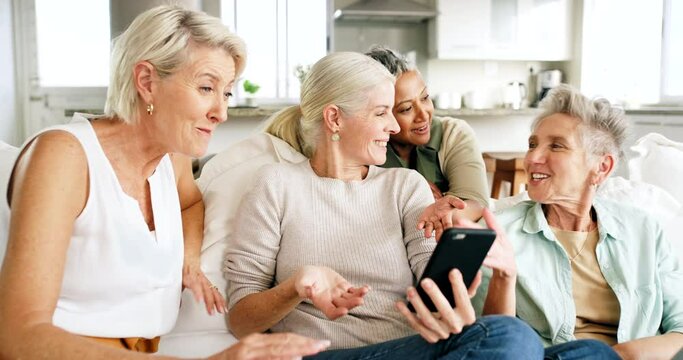 Relax, friends and senior women on with phone on sofa looking at pictures, meme and social media on smartphone. Friendship, happiness and group of old females having fun, talking and chat together