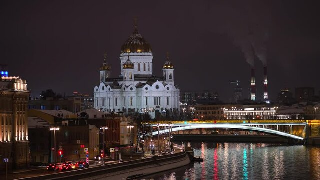Winter night footage in Moscow, Russia. Zoom in view of landmarks of the city. Moving traffic at night