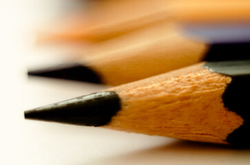 black pencil for drawing close-up on a light background. minimalism