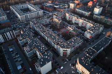 Modern residential complex in Wroclaw city, Poland. Aerial view of district with modern residence buildings, courtyards and parked cars.