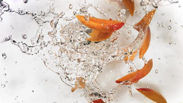 Slow Motion of Explosion Mango Slices and Burst Water Juice