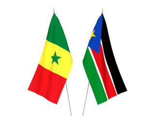 National fabric flags of Republic of South Sudan and Republic of Senegal isolated on white background. 3d rendering illustration.