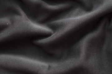 Obraz premium black wrinkled plush fabric background texture, soft material pattern