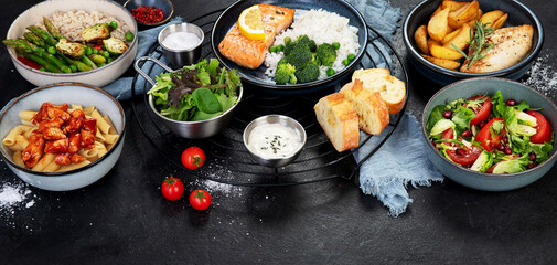 Table of various healthy food dishes. Healthy food assortment. Dieting concept.