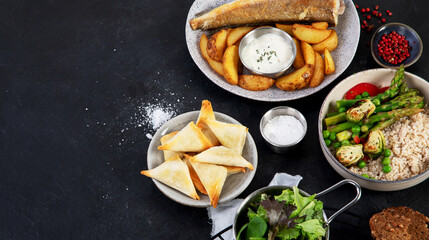 Table of various healthy food dishes. Healthy food assortment. Dieting concept.