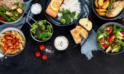 Table of various healthy food dishes. Healthy food assortment. Dieting concept.