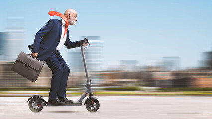 Corporate businessman riding a scooter - obrazy, fototapety, plakaty