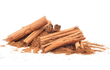 Pile of ground cinnamon and ceylon cinnamon sticks isolated on a white background - obrazy, fototapety, plakaty