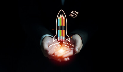 Businessman hand showing rocket pencil launching and flying to space on dark background, Startup...
