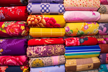 Artistic variety shade tone colors Bed sheets stacked on retail Shop Shelf to sale