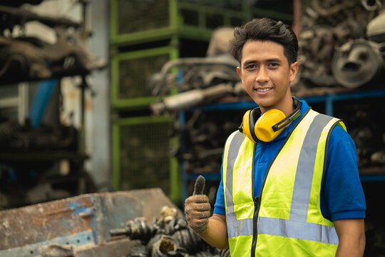portrait Asian young male engineer staff worker foreman work in heavy industry happy smiling