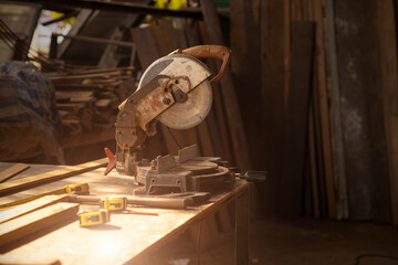 old wood workshop with saw machine workplace for furniture factory interior background