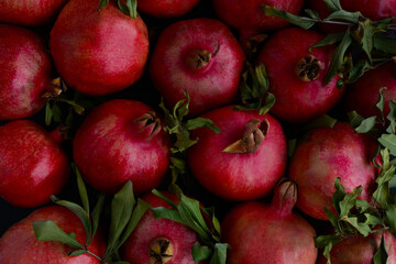 Fresh red ripe pomegranates. Juicy and tasty pomegranate fruits background