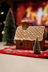 Decorated christmas gingerbread house in homely cozy atmosphere.