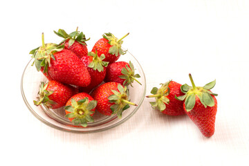 Fresh and Juicy beautiful organic strawberries on wooden background. Top view point.