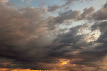 Naklejka na ściany i meble Dramatic or cinematic cloudscape at sunset or sunrise. Cloudy sky