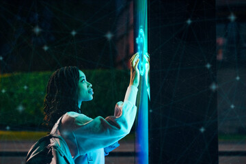 Young woman experimenting immersive experience at night