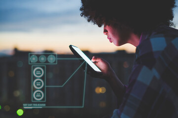 Woman surfing internet on mobile phone at dusk