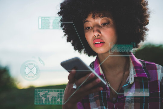 Young woman surfing net on smart phone at dusk