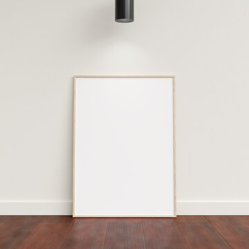 Minimal poster picture frame mockup leanings against the white wall. Blank frame mockup. Clean, modern, minimal frame. 3d rendering.