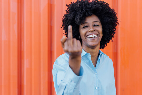 Happy Woman In Afro Hairstyle Showing Middle Finger