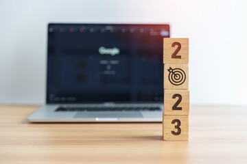 2023 Year block with dartboard icon against computer laptop background. Goal, Target, Resolution,...