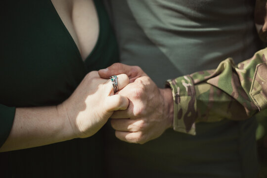 Close up married couple hands concept photo. Wedding ring. Front view photography with human hands on background. High quality picture for wallpaper, travel blog, magazine, article