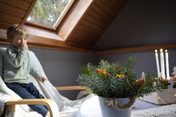 The child is happy with winter decorations for the holidays