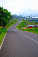 Fototapeta na wymiar Abstract Defocused Blurred Background is a beautiful and cool alternative highway in the Cikancung area - Indonesia. Not Focus